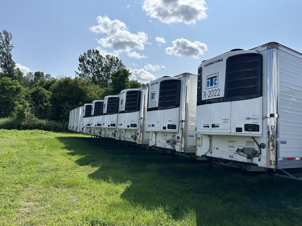 A row of late-model Thermo King reefer trailers in the Trailerly fleet